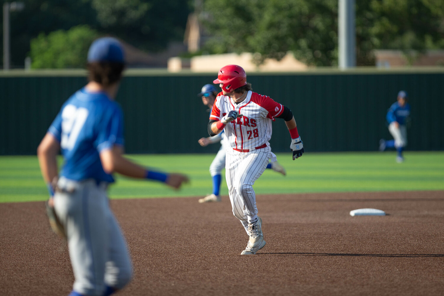Cole Kaase heads to third base during Thursday's Regional Semifinal between Katy and Clear Springs at Langham Creek.